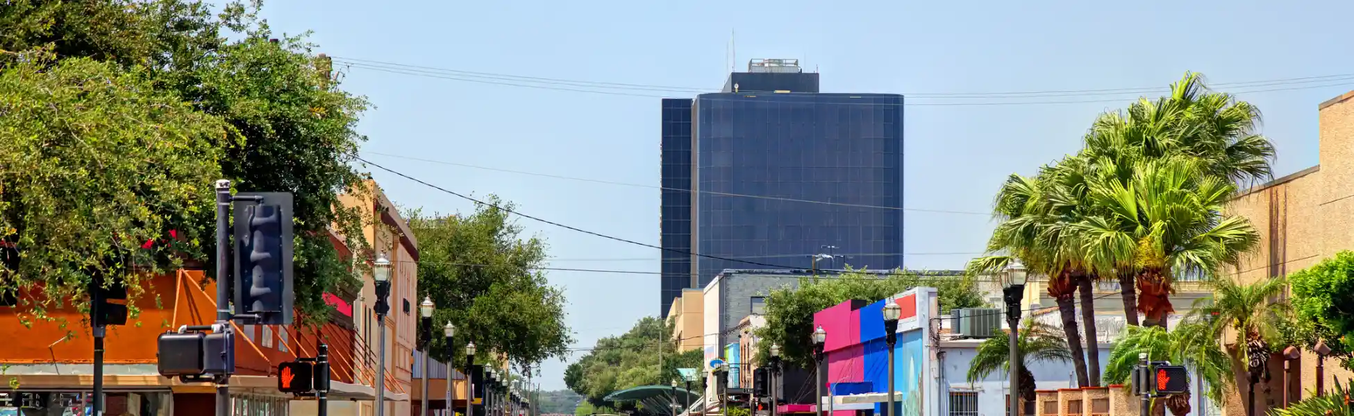 Neon color image of a band playing and people singing along