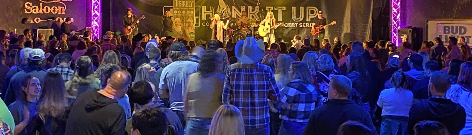country concert with fans wearing cowboy hats McAllen